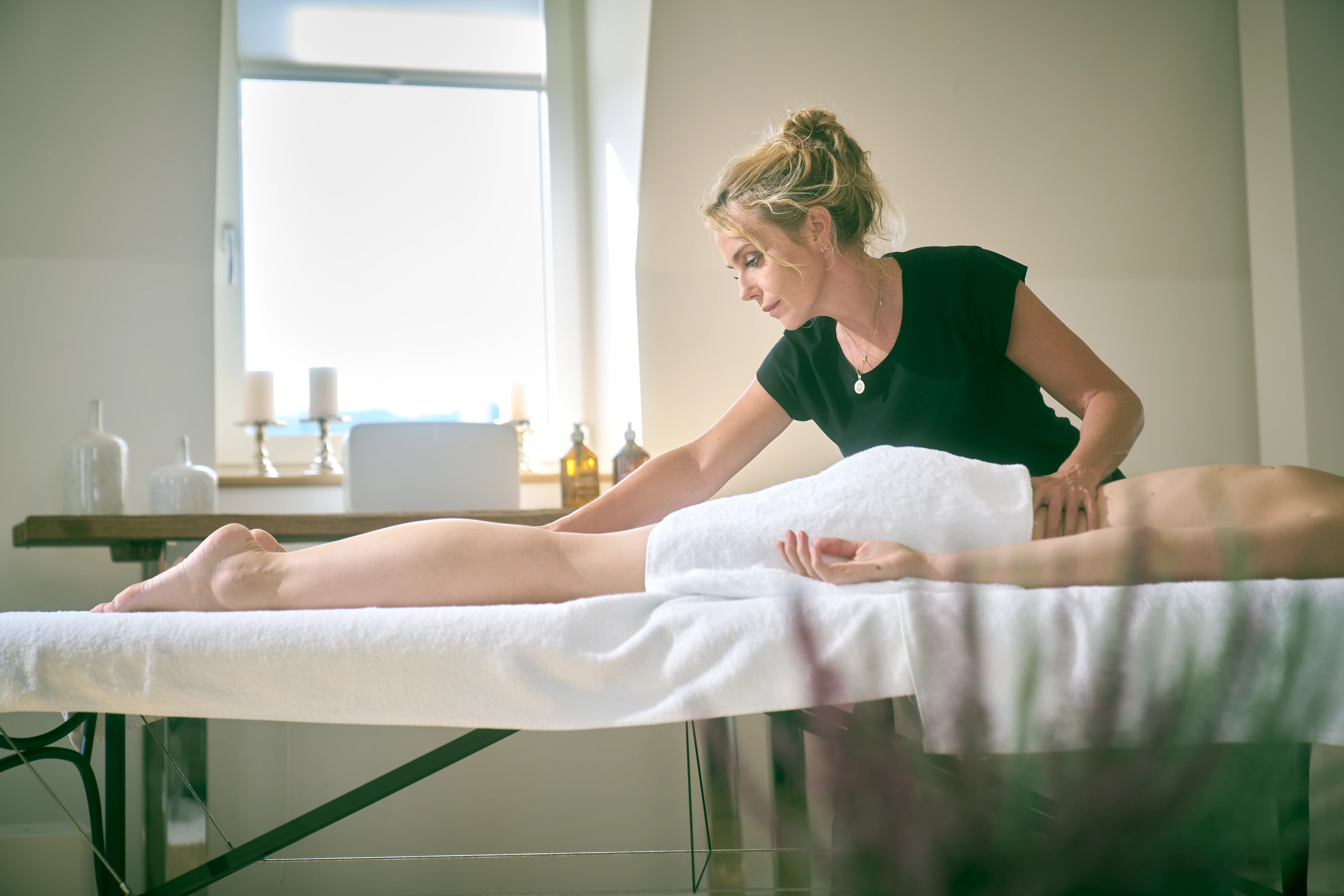 Therapist providing massage therapy treatment to client at Paracelsus Recovery